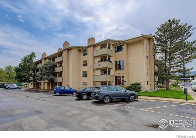 3030 Oneal Pkwy Unit 10, Boulder, CO 80301 - view of apartment building / complex featuring uncovered parking