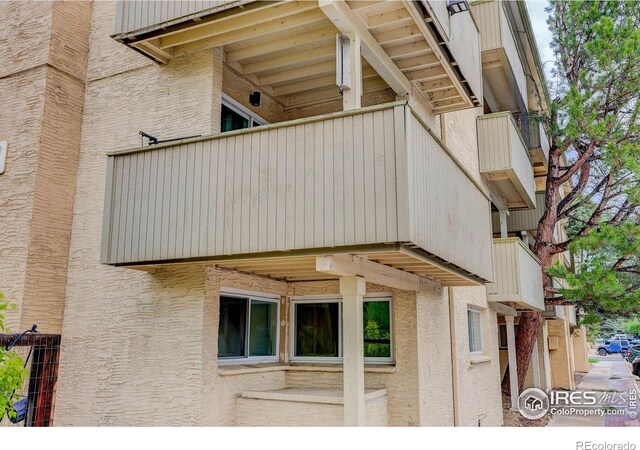 3030 Oneal Pkwy Unit 10, Boulder, CO 80301 - view of property exterior featuring a balcony and stucco siding
