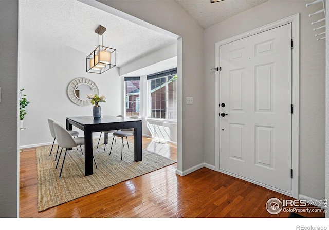 1970 Hamron Ct, Erie, CO 80516 - entrance foyer with a textured ceiling, hardwood / wood-style floors, and baseboards