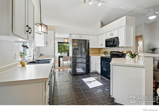 1970 Hamron Ct, Erie, CO 80516 - kitchen with black appliances, a sink, light countertops, decorative backsplash, and a textured ceiling