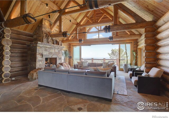 9126 Gold Mine Rd, Loveland, CO 80538 - living area featuring high vaulted ceiling, wooden ceiling, rustic walls, plenty of natural light, and beam ceiling