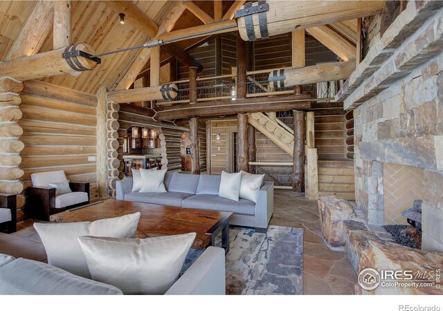 9126 Gold Mine Rd, Loveland, CO 80538 - living room featuring high vaulted ceiling, log walls, wood ceiling, and beamed ceiling