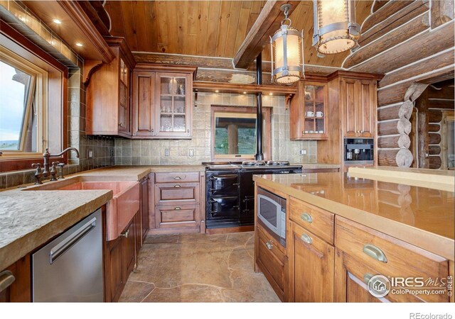 9126 Gold Mine Rd, Loveland, CO 80538 - kitchen featuring stainless steel appliances, wooden ceiling, brown cabinets, plenty of natural light, and stone finish flooring