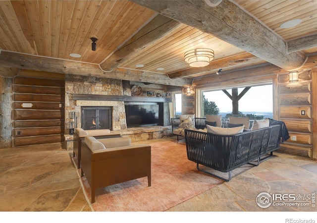9126 Gold Mine Rd, Loveland, CO 80538 - living room featuring wooden ceiling, healthy amount of natural light, rustic walls, stone tile flooring, and beam ceiling