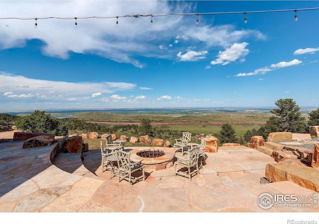 9126 Gold Mine Rd, Loveland, CO 80538 - view of patio with an outdoor fire pit