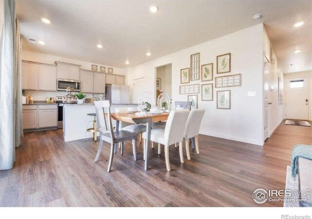 4204 Sandstone Dr, Mead, CO 80504 - dining room featuring dark wood-type flooring, recessed lighting, and baseboards
