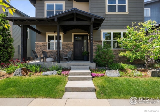 3663 Silverton St, Boulder, CO 80301 - craftsman-style home with covered porch and stone siding
