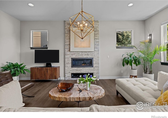 3663 Silverton St, Boulder, CO 80301 - living room with a chandelier, baseboards, recessed lighting, wood finished floors, and a fireplace