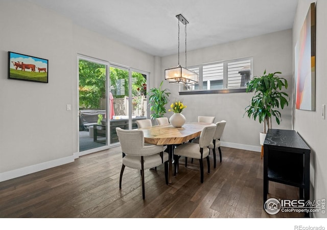 3663 Silverton St, Boulder, CO 80301 - dining area featuring dark wood-style floors, a chandelier, and baseboards