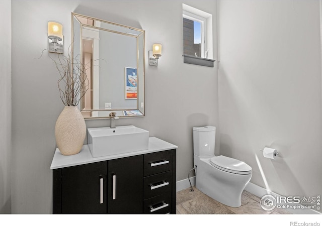 3663 Silverton St, Boulder, CO 80301 - half bath featuring baseboards, toilet, and vanity
