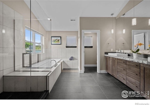 3663 Silverton St, Boulder, CO 80301 - full bathroom with baseboards, vanity, lofted ceiling, a garden tub, and tile patterned floors
