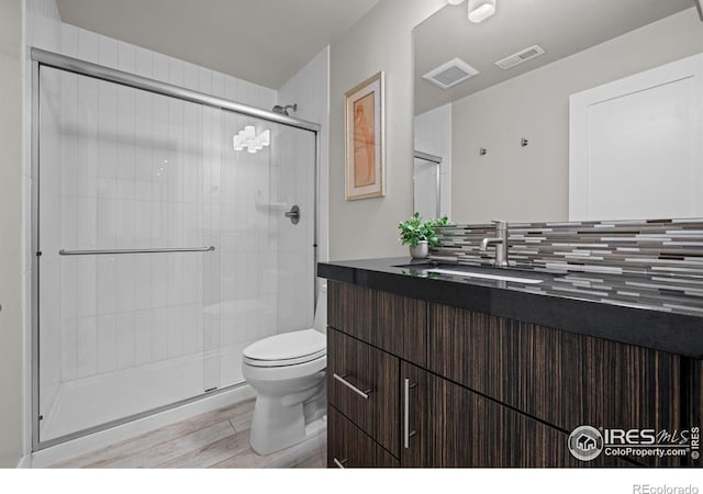 3663 Silverton St, Boulder, CO 80301 - bathroom with toilet, wood finished floors, a stall shower, and vanity