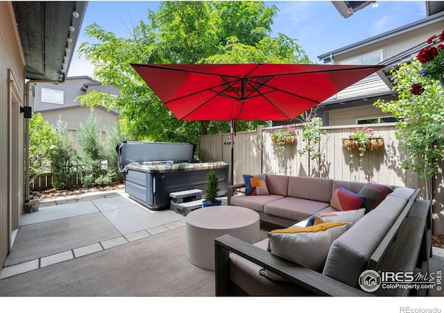 3663 Silverton St, Boulder, CO 80301 - view of patio with an outdoor living space, a hot tub, and fence