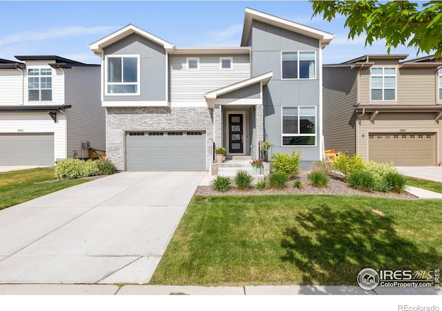 contemporary house with brick siding, an attached garage, a front lawn, and concrete driveway