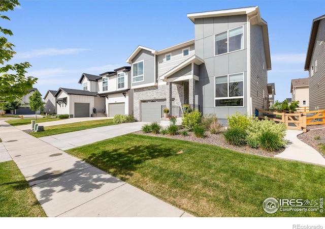 view of front of house with concrete driveway, a residential view, an attached garage, and stucco siding