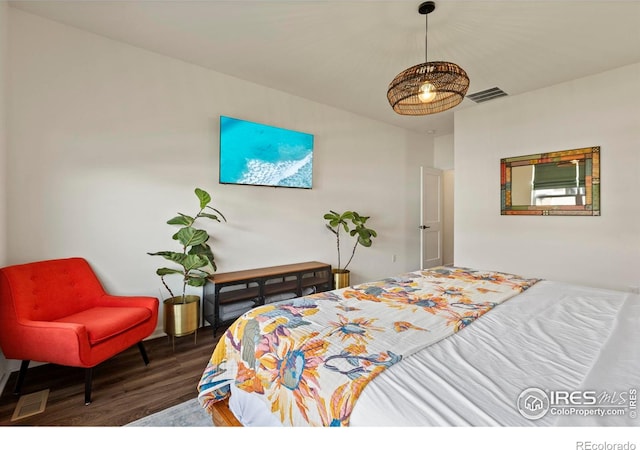 bedroom with wood finished floors