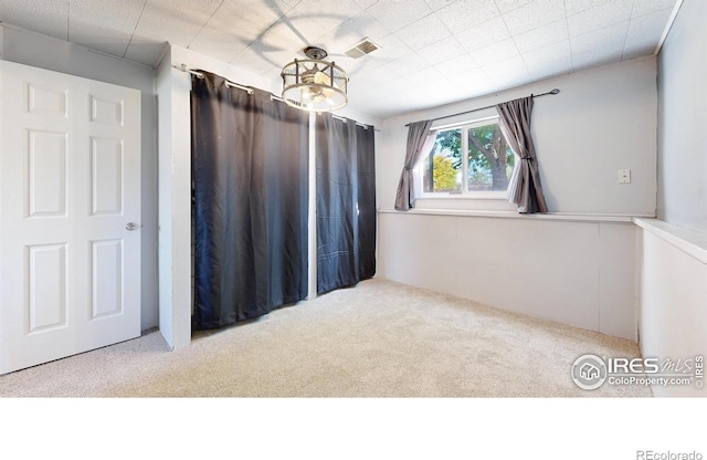 unfurnished room with carpet flooring