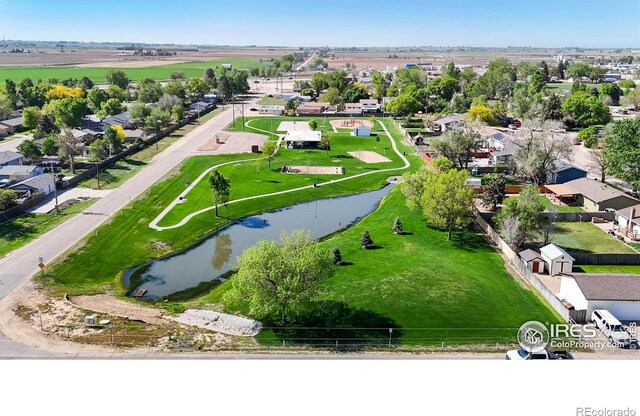 aerial perspective of suburban area featuring a nearby body of water