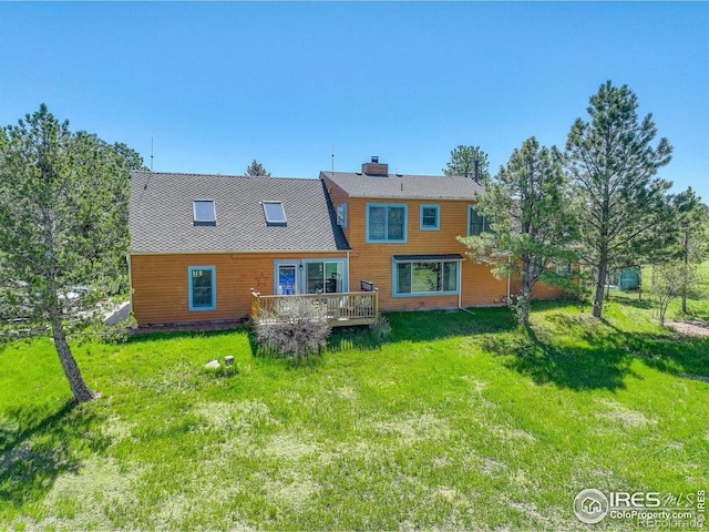 2219 Meadow Green Cir, Franktown, CO 80116 - rear view of house with a wooden deck, a yard, and a chimney