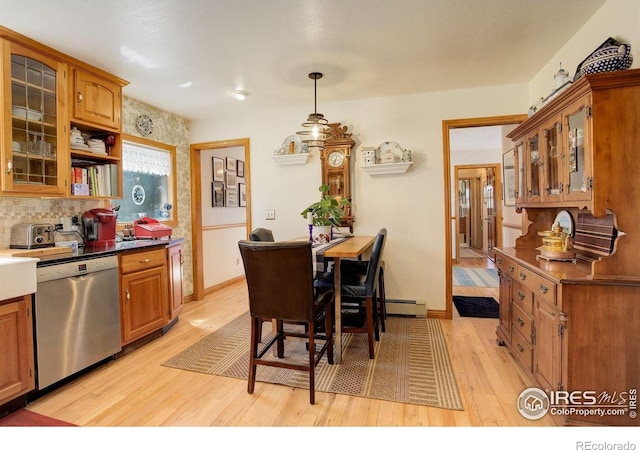 2219 Meadow Green Cir, Franktown, CO 80116 - kitchen with dishwasher, light wood-type flooring, brown cabinetry, and glass insert cabinets