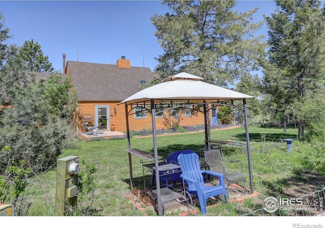 2219 Meadow Green Cir, Franktown, CO 80116 - view of grassy yard featuring a gazebo and a patio area
