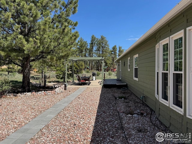 view of yard featuring a deck