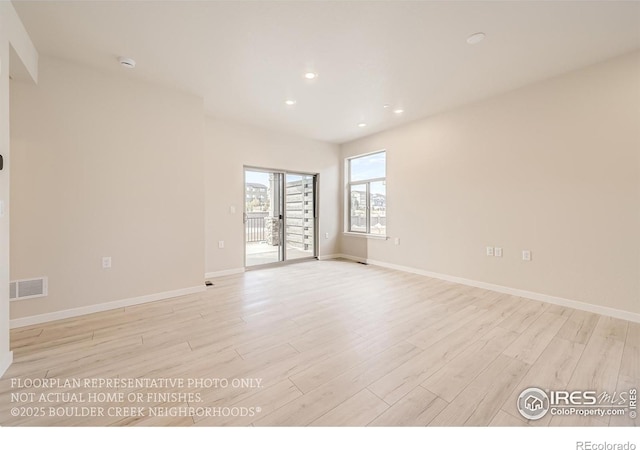unfurnished room featuring light wood-type flooring, recessed lighting, baseboards, and a smoke detector