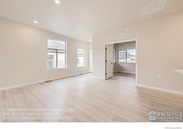 unfurnished room with light wood-style flooring, baseboards, and recessed lighting