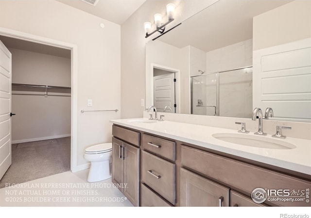 bathroom featuring a shower stall, double vanity, toilet, a spacious closet, and baseboards