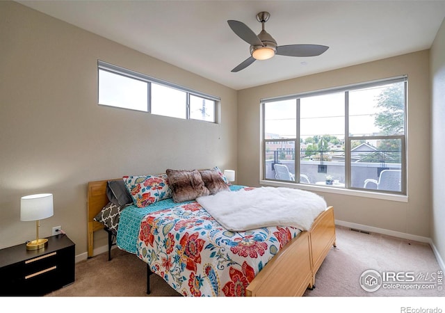 2100 N Clay St, Denver, CO 80211 - carpeted bedroom with baseboards and a ceiling fan