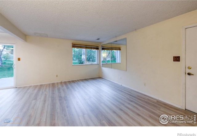 4140 Monroe Dr Unit C, Boulder, CO 80303 - unfurnished room featuring a textured ceiling, wood finished floors, and baseboards