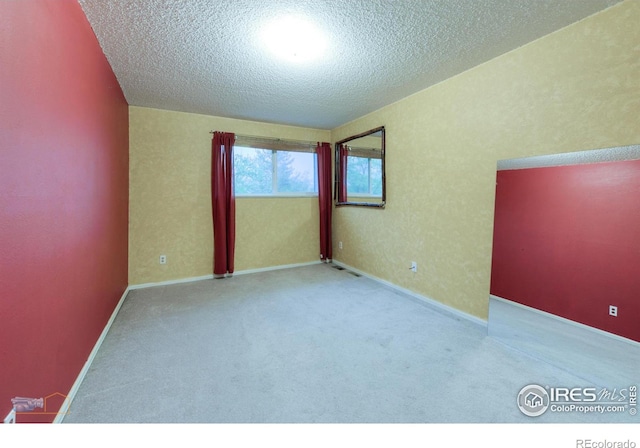 4140 Monroe Dr Unit C, Boulder, CO 80303 - spare room featuring carpet, a textured ceiling, and baseboards