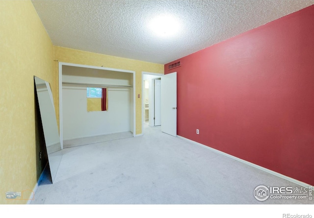 4140 Monroe Dr Unit C, Boulder, CO 80303 - unfurnished bedroom featuring a textured ceiling and carpet flooring