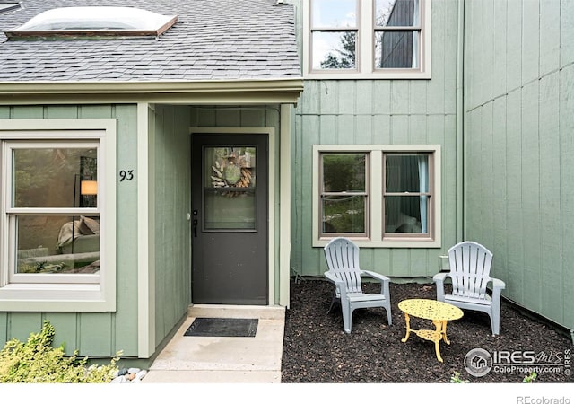 93 Benthaven Pl, Boulder, CO 80305 - doorway to property featuring roof with shingles