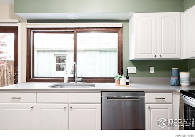 93 Benthaven Pl, Boulder, CO 80305 - kitchen with appliances with stainless steel finishes, a sink, white cabinets, and plenty of natural light