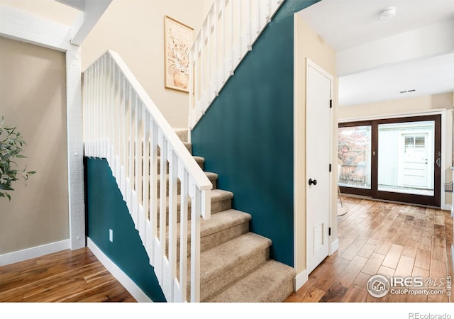 93 Benthaven Pl, Boulder, CO 80305 - staircase with wood finished floors and baseboards