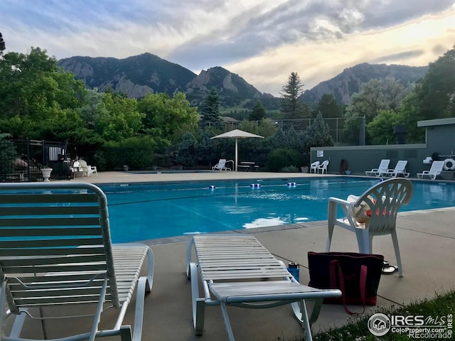 93 Benthaven Pl, Boulder, CO 80305 - community pool featuring a mountain view, fence, and a patio area