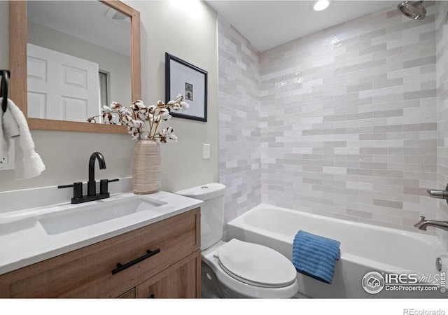 full bathroom featuring toilet, vanity, bathtub / shower combination, and recessed lighting