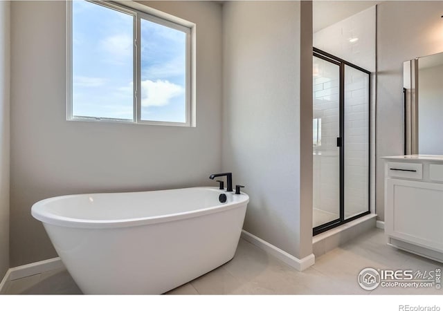 2710 Crystal Spgs, Longmont, CO 80503 - bathroom with a soaking tub, a shower stall, and plenty of natural light