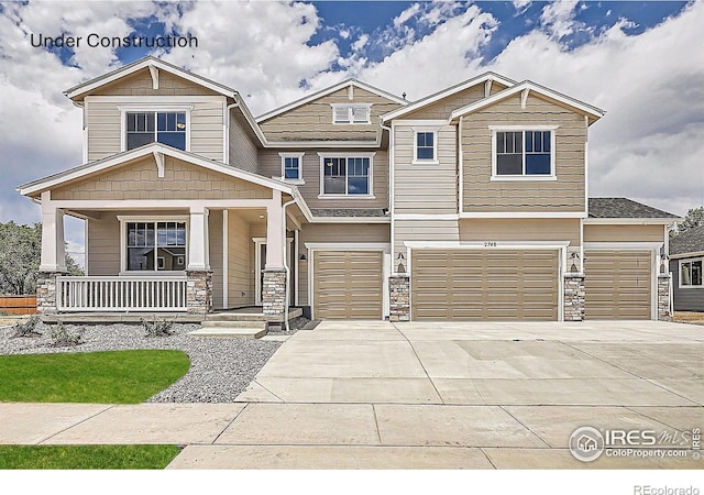2710 Crystal Spgs, Longmont, CO 80503 - craftsman inspired home with stone siding, an attached garage, covered porch, and driveway