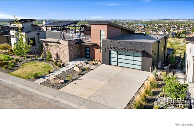 2123 Picture Point Dr, Windsor, CO 80550 - contemporary house with concrete driveway, a garage, and a residential view