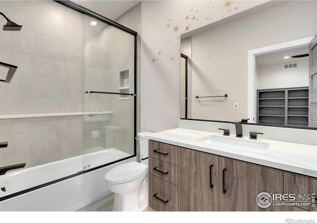 2123 Picture Point Dr, Windsor, CO 80550 - bathroom featuring vanity, shower / bath combination with glass door, and toilet