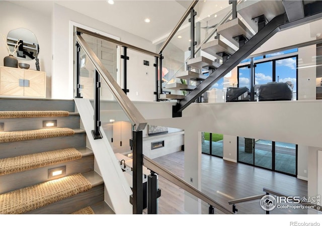 2123 Picture Point Dr, Windsor, CO 80550 - stairway featuring wood finished floors and recessed lighting