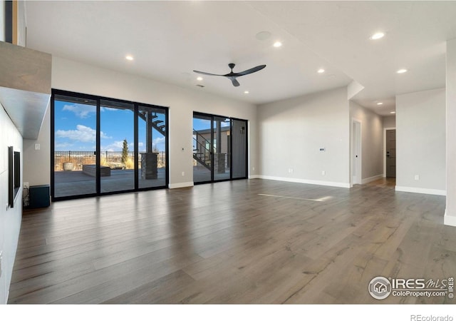 2123 Picture Point Dr, Windsor, CO 80550 - unfurnished living room with recessed lighting, ceiling fan, wood finished floors, and baseboards