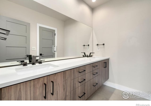 2123 Picture Point Dr, Windsor, CO 80550 - bathroom with baseboards, double vanity, and tile patterned flooring