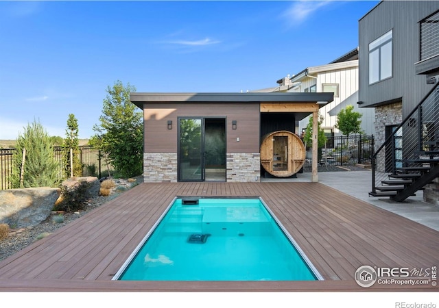 2123 Picture Point Dr, Windsor, CO 80550 - view of swimming pool with a deck and fence