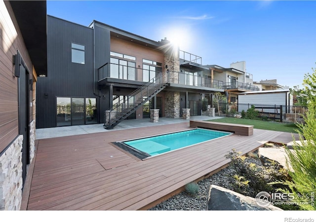 2123 Picture Point Dr, Windsor, CO 80550 - rear view of house with fence, stairway, a wooden deck, and a patio