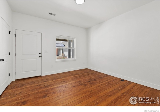 7864 5th St, Wellington, CO 80549 - unfurnished room featuring hardwood / wood-style floors and baseboards