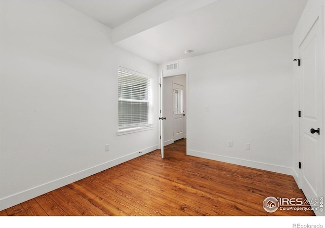 7864 5th St, Wellington, CO 80549 - spare room featuring baseboards and wood-type flooring