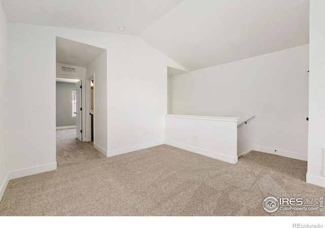 7864 5th St, Wellington, CO 80549 - empty room featuring carpet flooring, lofted ceiling, and baseboards
